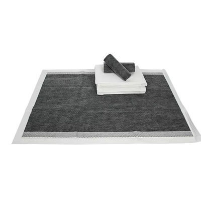 Des coussins d'entraînement jetables pour animaux avec du charbon de bambou super absorbant et un autocollant adhésif